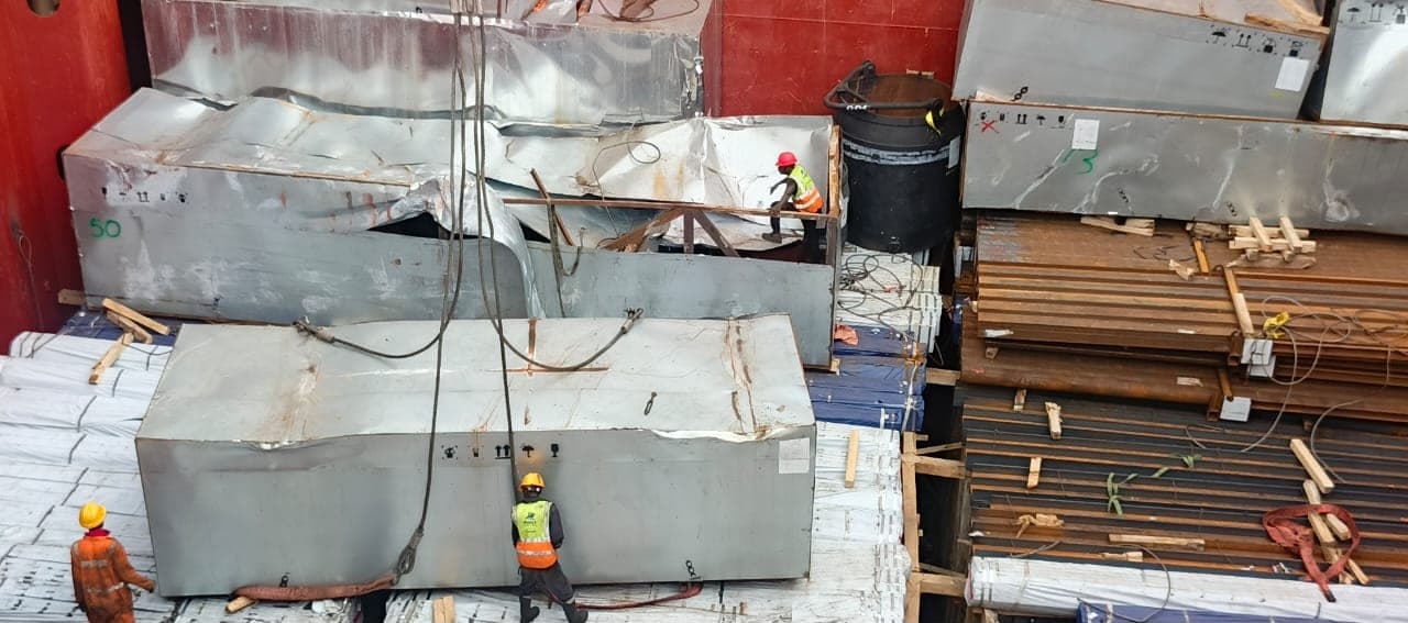 Supervisor overseeing cargo lashing and securing in a vessel hold