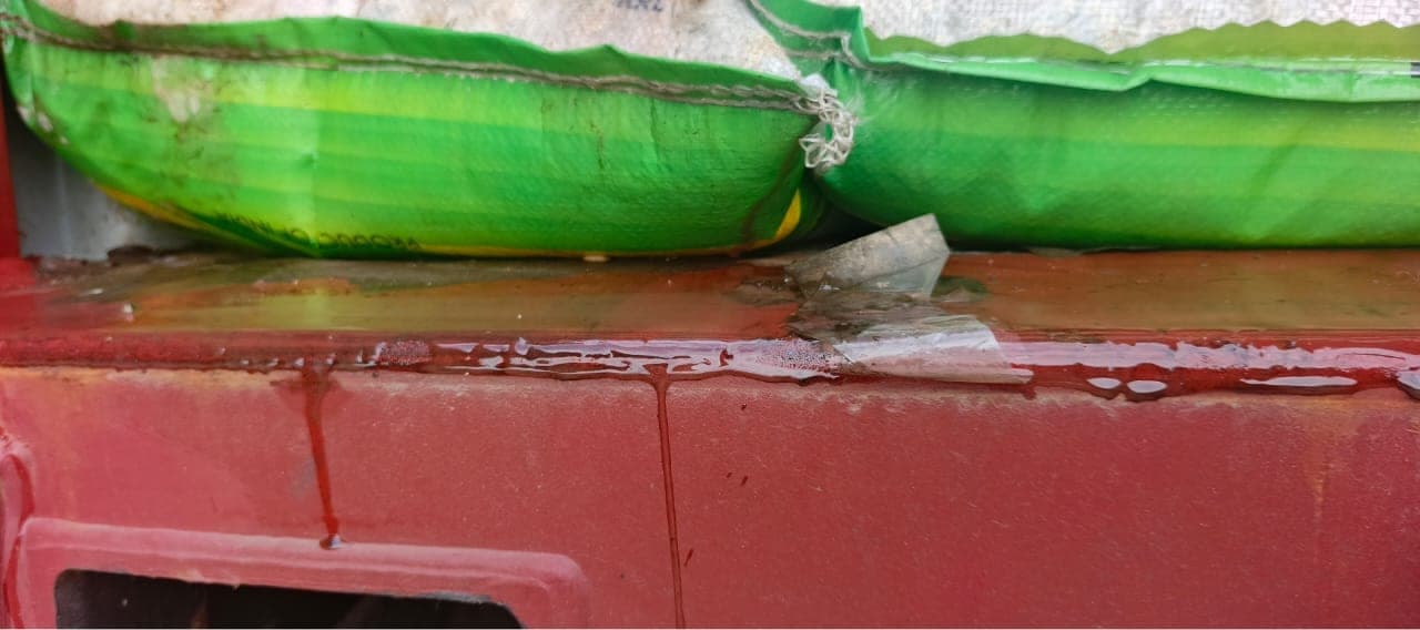 Close-up of liquid damage on cargo packaging
