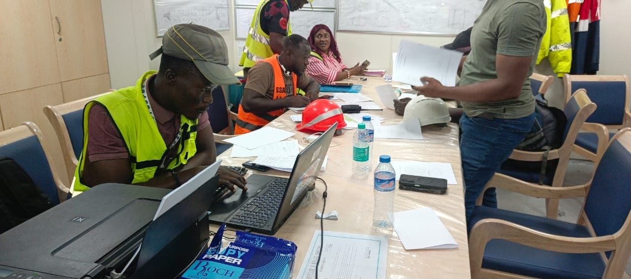 Team reviewing cargo documentation and reports in the office